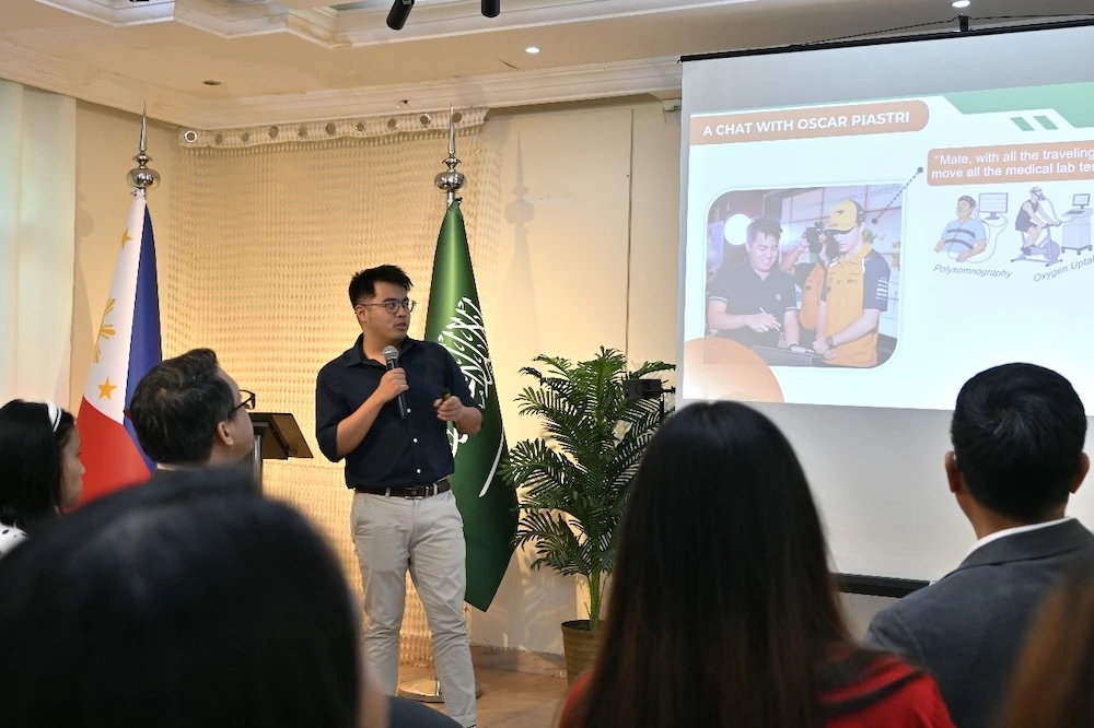 Neil Joshua Limbaga, a PhD student in electrical and computer engineering at King Abdullah University of Science and Technology presents his research at the Philippine Consulate General in Jeddah, Oct. 30, 2025. (Philippine Consulate General)