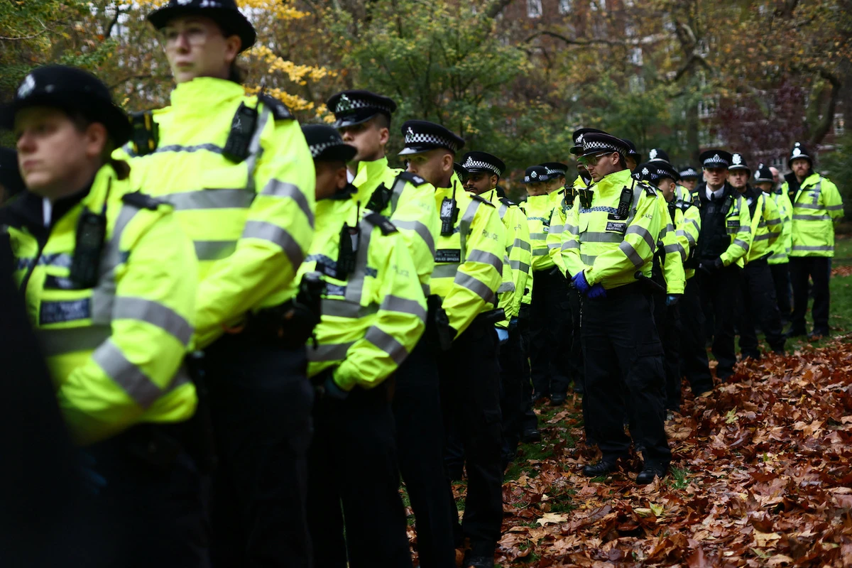 Police officers look on as supporters from Defend Our Juries stage a demonstration in Tavistock Square as part of campaign to lift ban on Palestine Action ahead of judicial review at London’s High Court next week, in London, November 22, 2025. (Reuters)