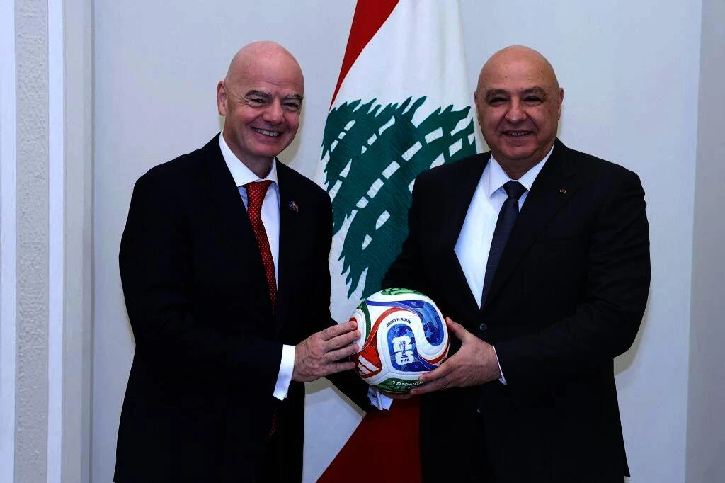A handout photograph released by the Lebanese Presidency’s press office shows FIFA president Gianni Infantino posing with Lebanese President Joseph Aoun after their meeting at the presidential palace of Baabda, Beirut, on Nov. 25, 2025. (AFP)