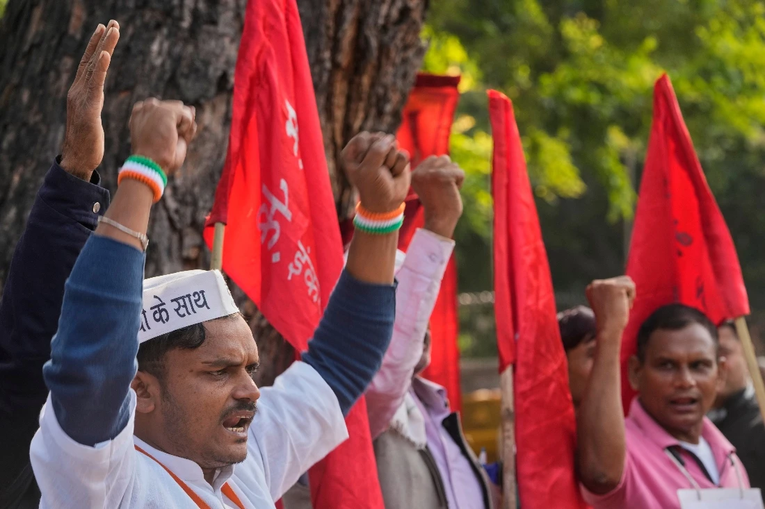 Members of various Indian trade unions shout slogans during a protest against the government's rollout of new labor codes in New Delhi, India. (AP)