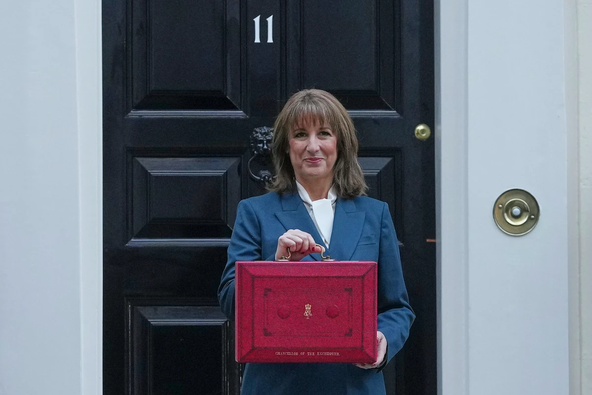 Britain's Chancellor of the Exchequer Rachel Reeves poses on the doorstep of 11 Downing Street with her ministerial red box before heading to the House of Commons. (AP)