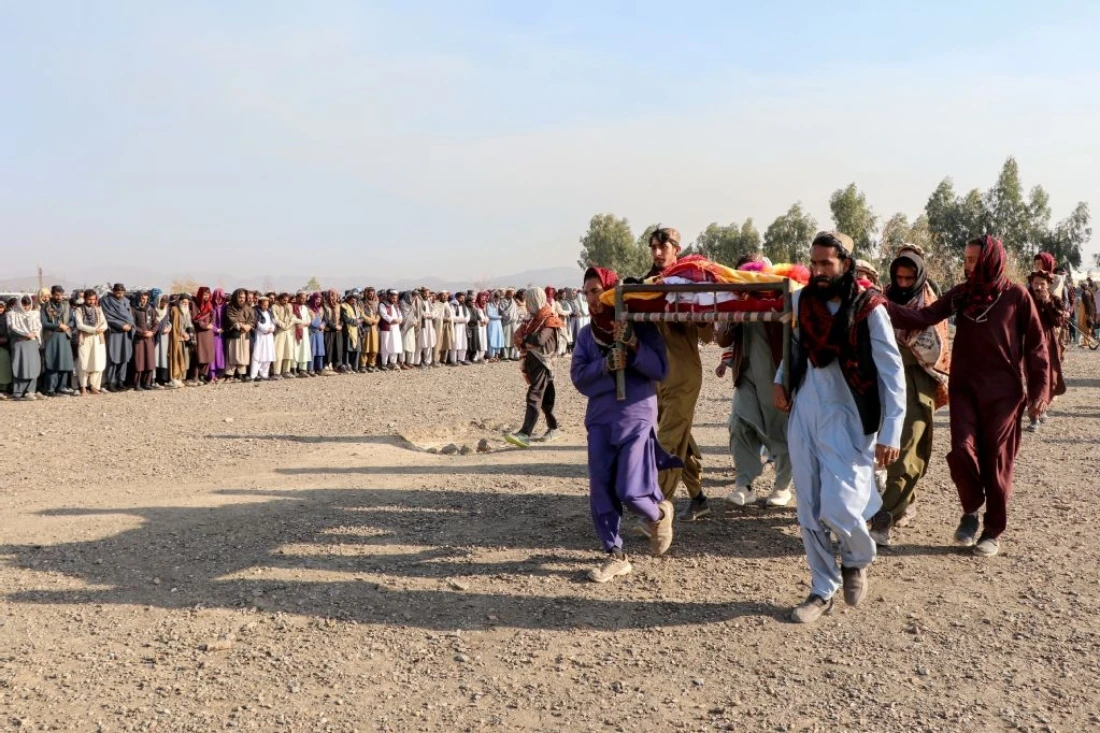 Afghan mourners and relatives of victims carry the coffin during a mass burial ceremony for nine children and one woman who were killed by a Pakistan air strike, in the Gurbuz district of Khost Province. (AFP)
