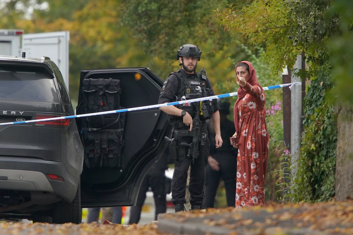 An armed police officer at the scene of the attack at Heaton Park Hebrew Congregation synagogue, in Manchester on October 2. (AP/File)