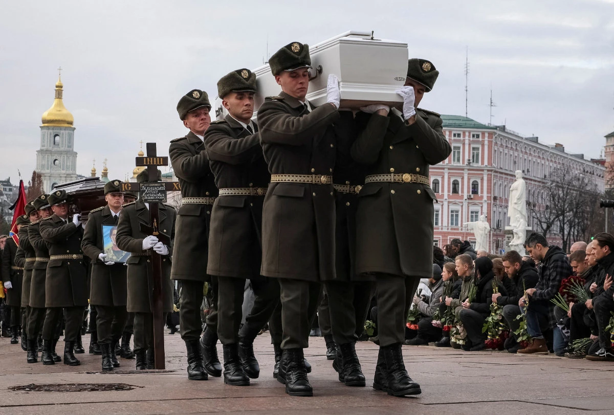 Ukrainian service members carry coffins with the body of their brothers-in-arms, who was recently killed in fighting against Russian troops, during a funeral ceremony in Kyiv, Ukraine, on November 28, 2025. (REUTERS)