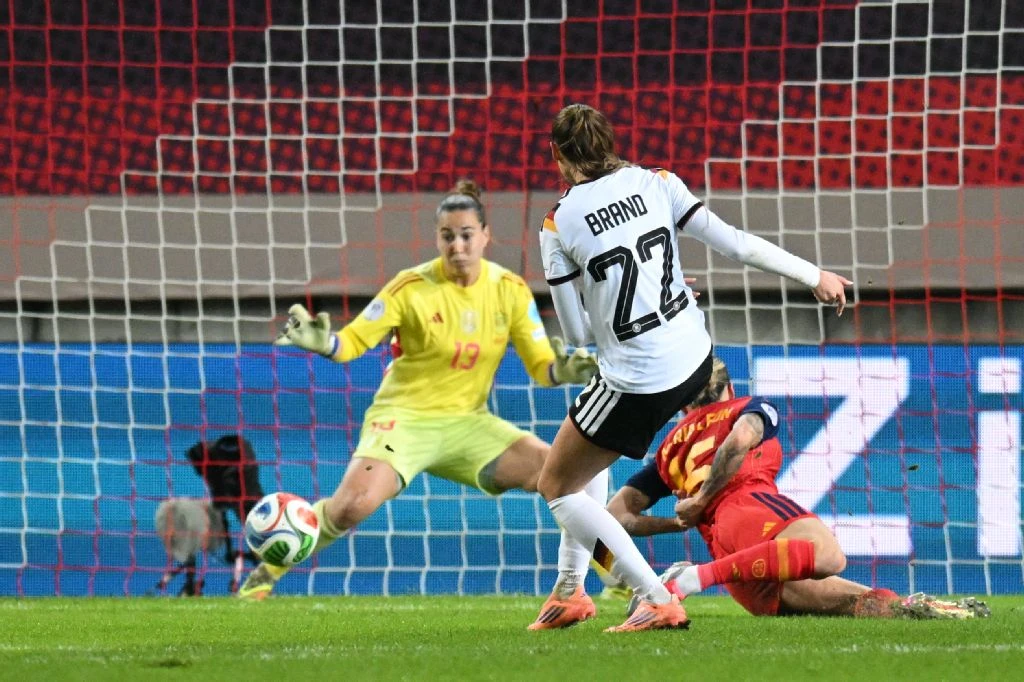 Germany’s midfielder Jule Brand fails to score past Spain’s goalkeeper Cata Coll during UEFA Women's Nations League first leg final between Germany and Spain in Kaiserslautern, western Germany on Friday. (AFP)