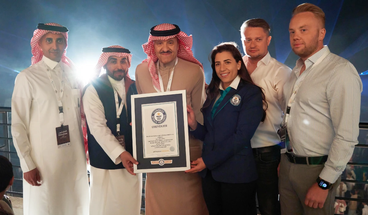 Prince Sultan bin Salman, founder and chairman of the Saudi Aviation Club, along with other officials, receives the Guinness World Record certificate. (Supplied)