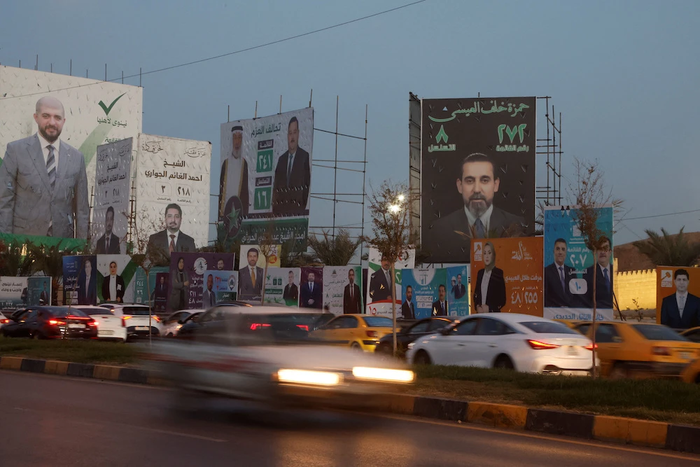 Campaign billboards for parliamentary candidates are displayed on a Mosul street, ahead of parliamentary elections. (Reuters)