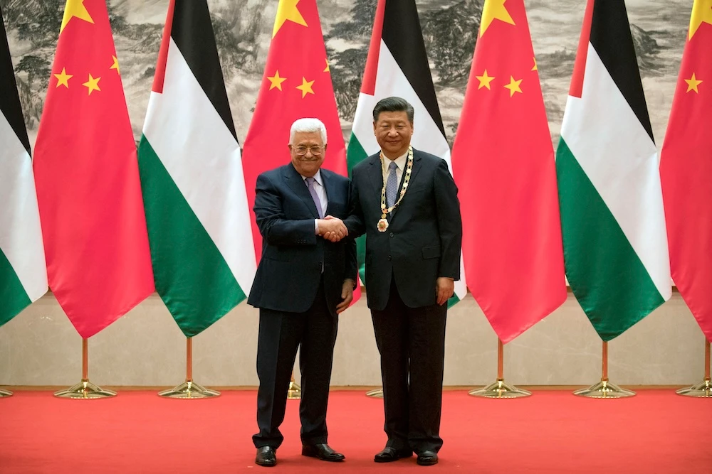 Chinese President Xi Jinping welcomes Palestinian President Mahmoud Abbas in Beijing on July 18, 2017. (AFP)
