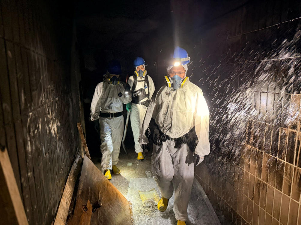 Above, Hong Kong police personnel during a search operation at the Wang Fuk Court housing complex on Nov. 30, 2025. (Hong Kong Police Force via Reuters)
