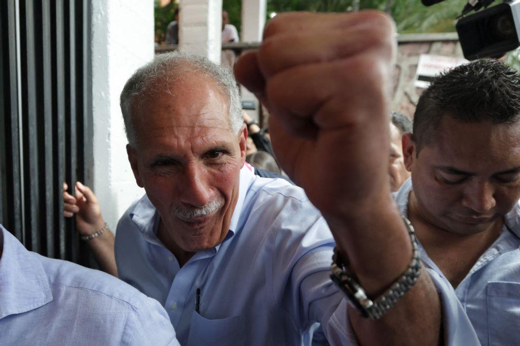 Honduras presidential candidate of the National Party Nasry Asfura raises his clenched fist as he arrives to cast his vote in Tegucigalpa on Nov. 30, 2025. (AFP)