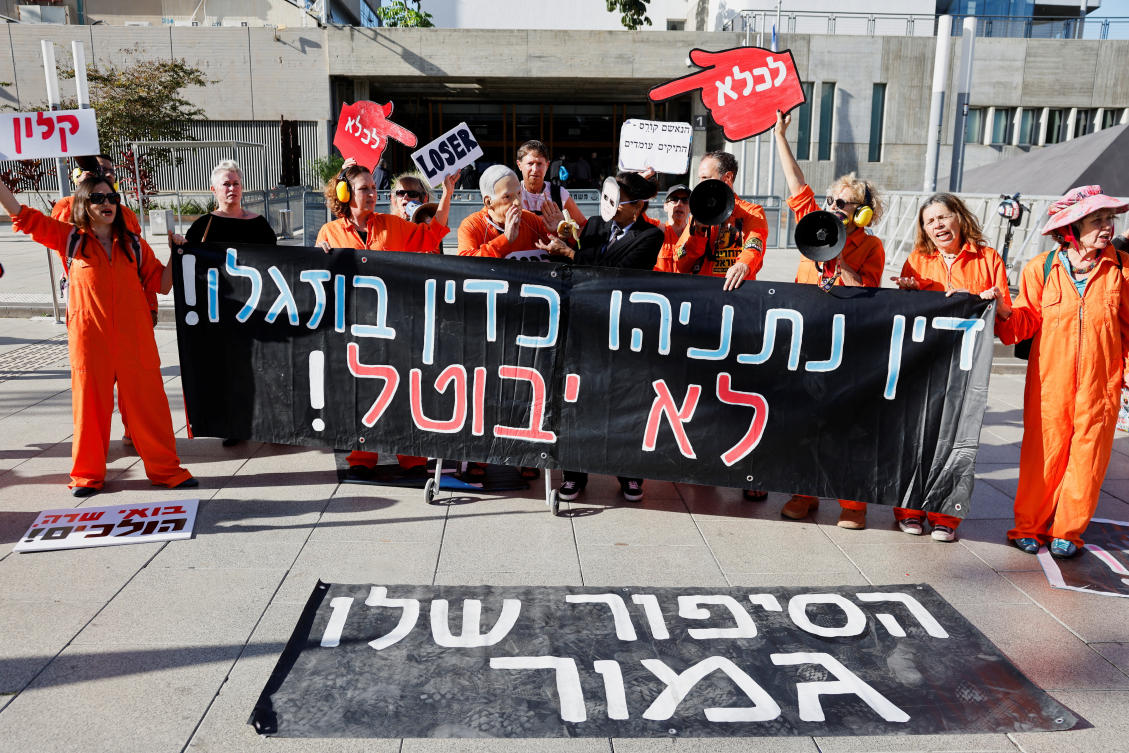 Israelis take part in a protest, after Israeli Prime Minister Benjamin Netanyahu requested President Isaac Herzog to pardon his corruption trial, outside a courthouse in Tel Aviv on Dec. 1, 2025. (Reuters)