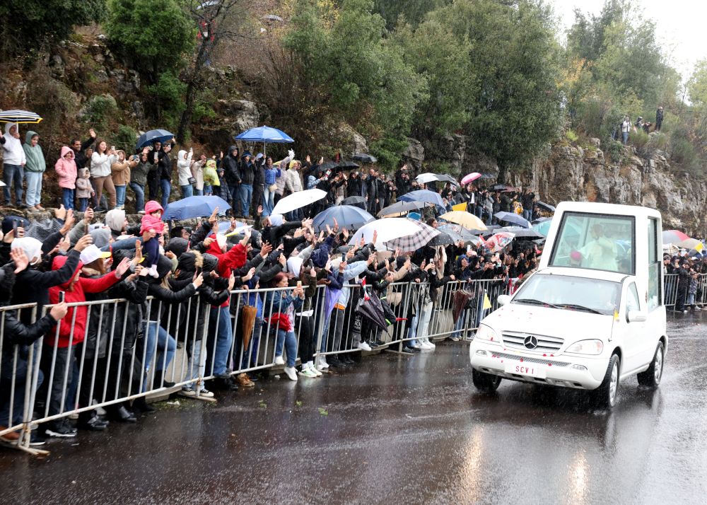 Despite the cold weather and heavy rain, thousands of people of all ages gathered from early morning to greet Pope Leo XIV, lining roads leading from the coastal city of Byblos to Annaya. (Supplied)