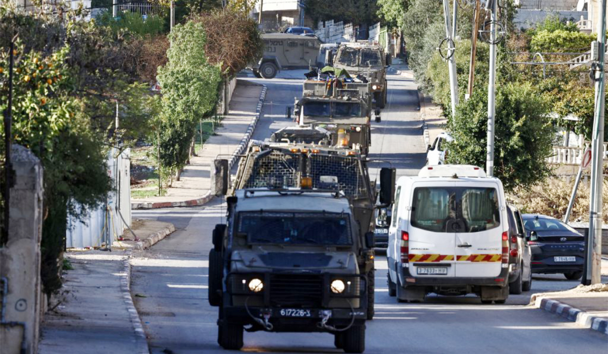 Israeli military vehicles roll during a raid in Ramallah, in the occupied West Bank on December 1, 2025. (AFP)