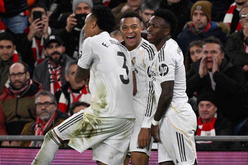 Real Madrid’s French forward Kylian Mbappe celebrates with teammates Vinicius Junior and Eder Militao after scoring his team’s third goal during their Spanish league match against Athletic Club Bilbao at the San Mames stadium in Bilbao on Dec. 3, 2025. (AFP)