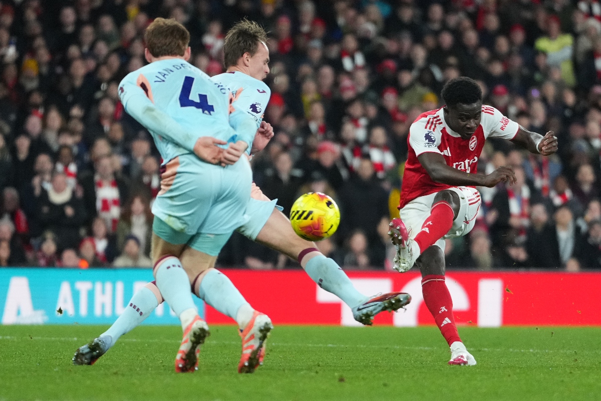 Arsenal’s Bukayo Saka scores during a Premier League football match between Arsenal and Brentford in London Wednesday. (AP)
