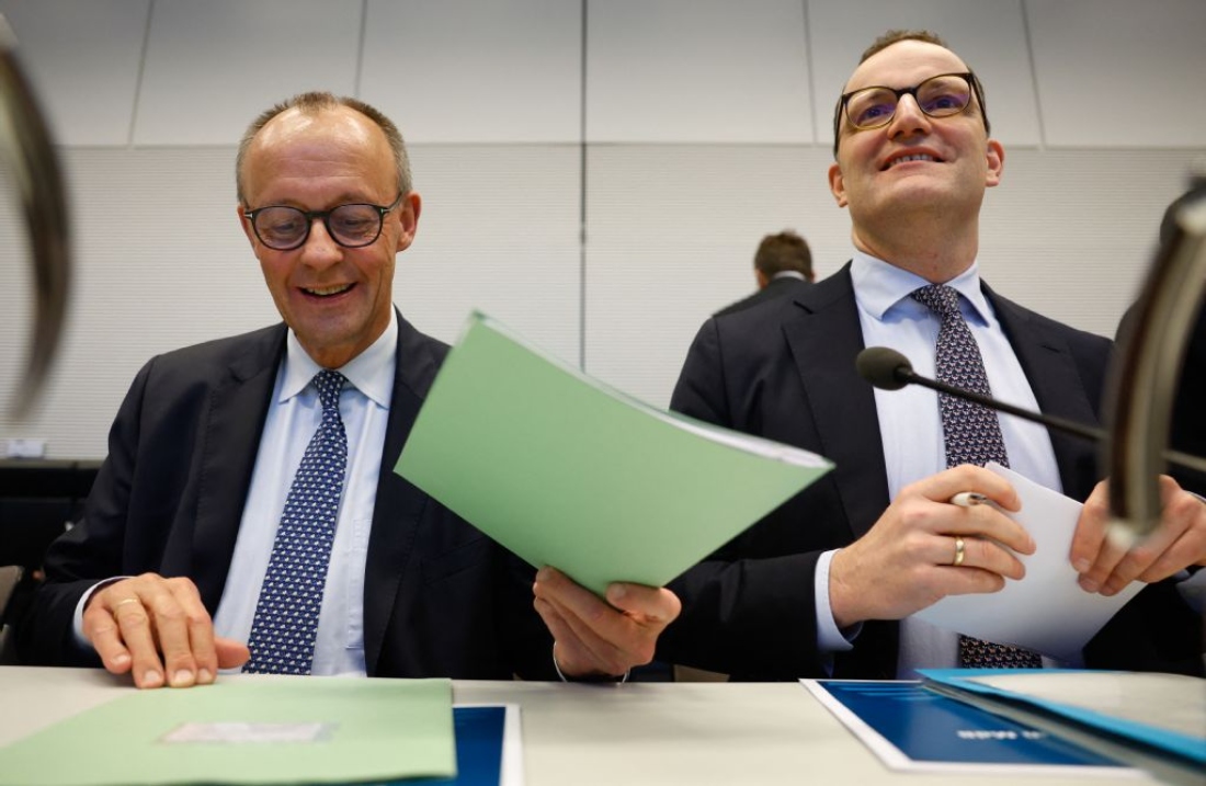 German Chancellor and leader of Germany's Christian Democratic Union (CDU) Friedrich Merz and the parliamentary group leader of the conservative Christian Democratic Union (CDU) Jens Spahn sit at the start of a parliamentary group meeting of the conservative party union in Berlin, Germany. (AFP)
