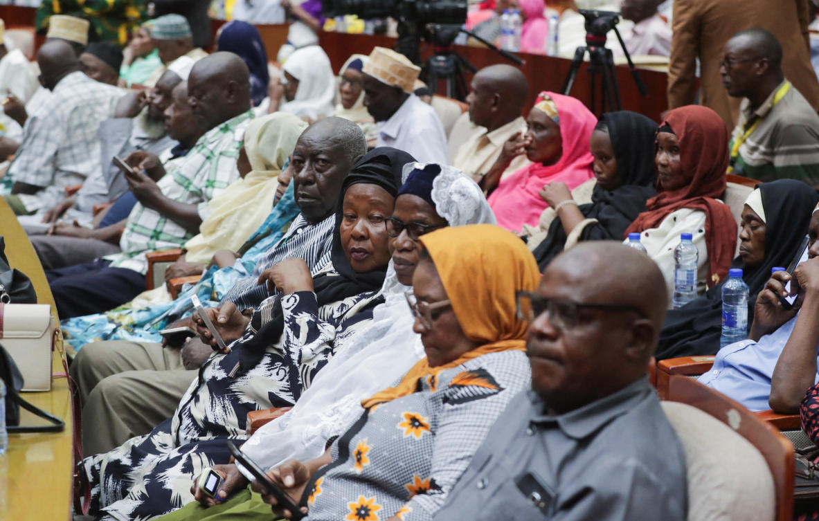 Tanzanian elderly people listen to Tanzania's President Samia Suluhu Hassan during a meeting as part of efforts to foster peace and national unity following the October 29 general election, in Dar es Salaam, Tanzania December 2, 2025. REUTERS/Emmanuel Herman