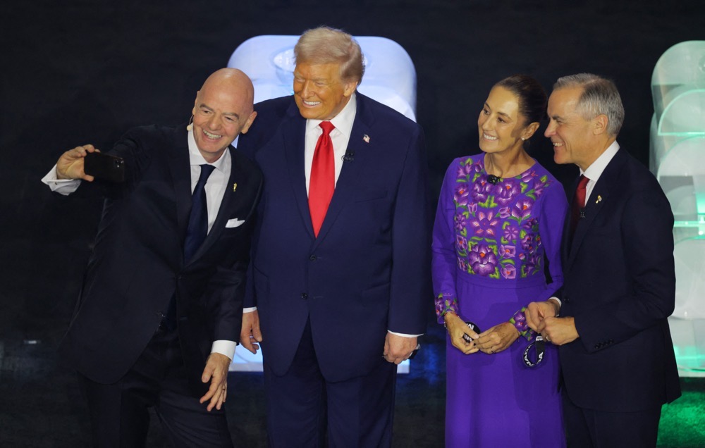 President Donald Trump, Mexico's President Claudia Sheinbaum and Canada's Prime Minister Mark Carney take a selfie with FIFA President Gianni Infantino during the FIFA World Cup 2026 draw. (Reuters)