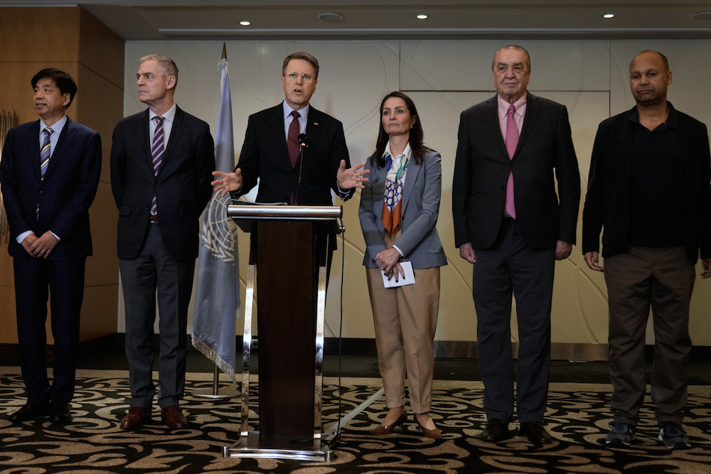 Samuel Zbogar, third left, Slovenia's permanent representative to the United Nations and president of the Security Council, delivers a statement with his delegation in Beirut, Lebanon, on Saturday, Dec. 6. (AP)