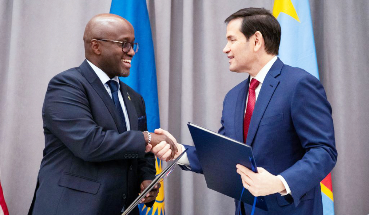 US Secretary of State Marco Rubio (R) and Rwandan Foreign Minister Olivier Nduhungirehe shake hands during a signing ceremony at the US Institute of Peace in Washington, DC on December 4, 2025. (AFP)