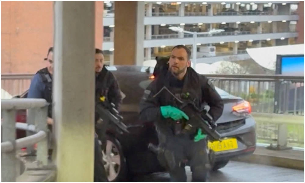 Police officers respond following an incident at Heathrow Airport, as seen through a car windscreen, in London, Britain, Dec. 7, 2025. (Screengrab via Reuters / cropped / 3rd party)