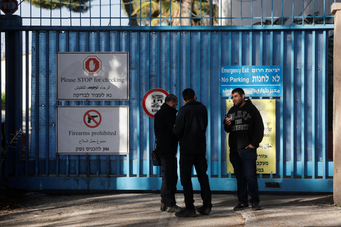 Israeli police officers wait outside the United Nations Relief and Works Agency for Palestine Refugees (UNRWA) headquarters, in Jerusalem December 8, 2025. (Reuters)