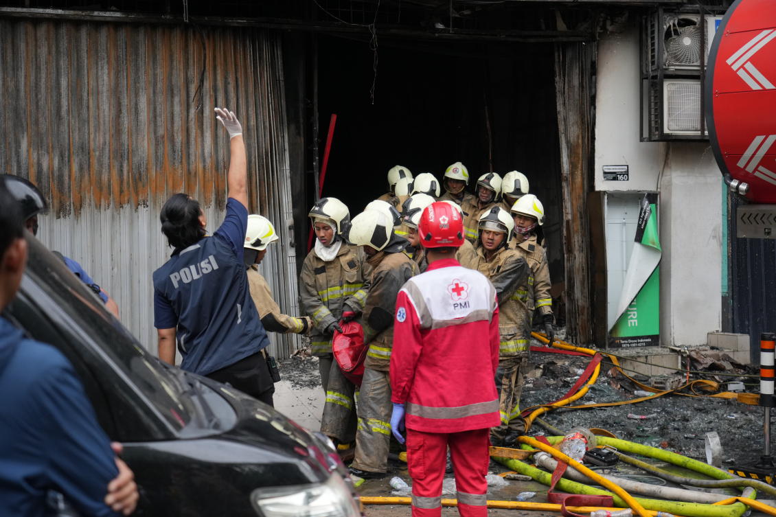 Rescuers carry out the body of a victim from the site of a fire in Jakarta, Indonesia on Dec. 9, 2025. (AP)
