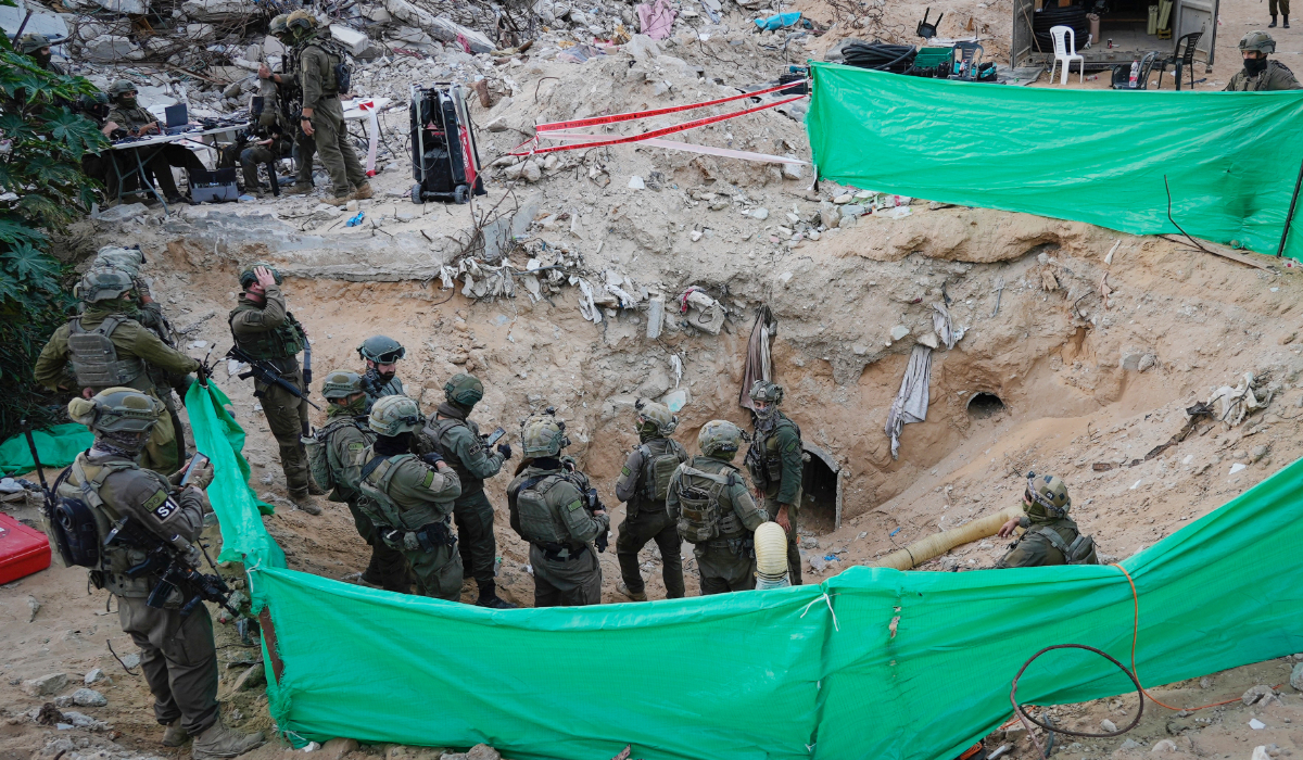 Israeli soldiers stand at the entrance of a tunnel where the army says the body of soldier Hadar Goldin was held in Rafah, Gaza Strip, Monday, Dec. 8, 2025. (AP)