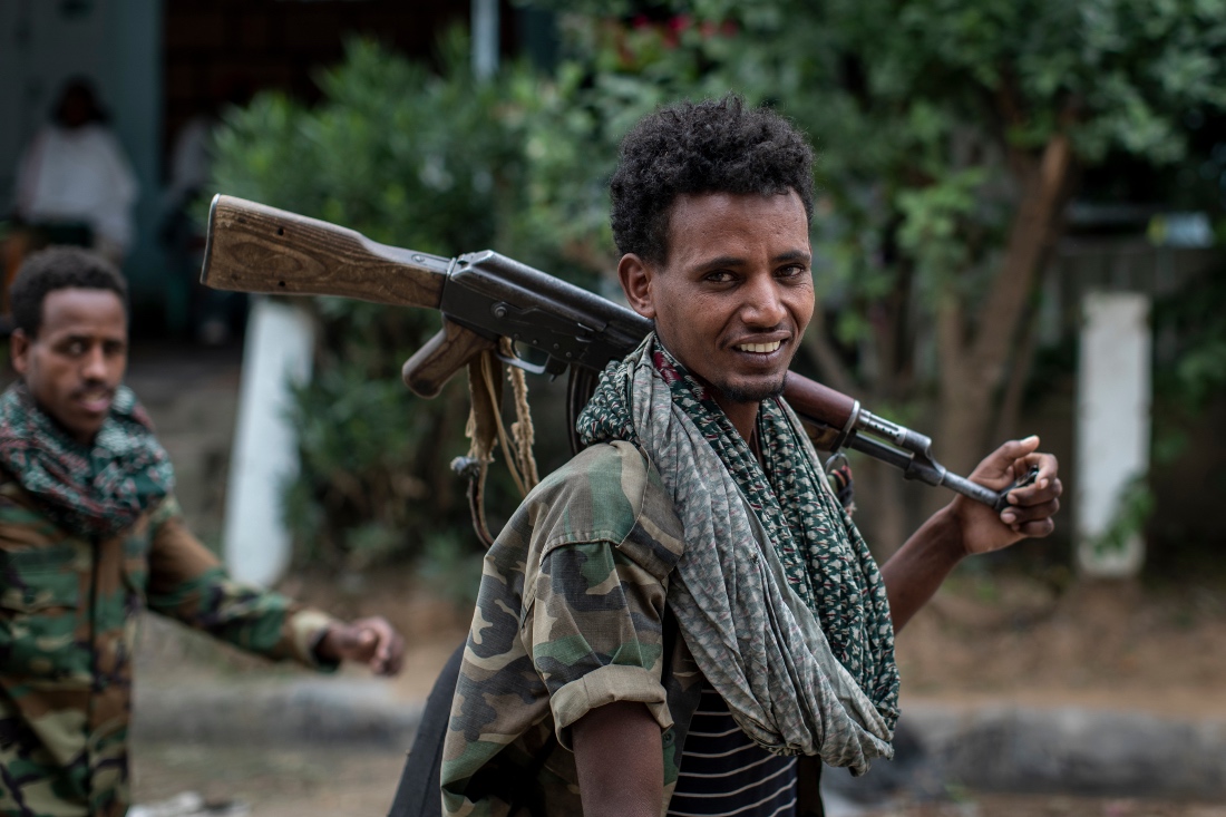 Fighters loyal to the Tigray People's Liberation Front (TPLF) walk along a street in the town of Hawzen, Ethiopia. (AP)