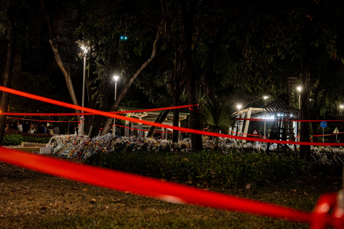 File photo shows people pay their respects for the victims of a deadly fire at the Wang Fuk Court residential estate in Tai Po district of Hong Kong on December 7, 2025. (AFP)
