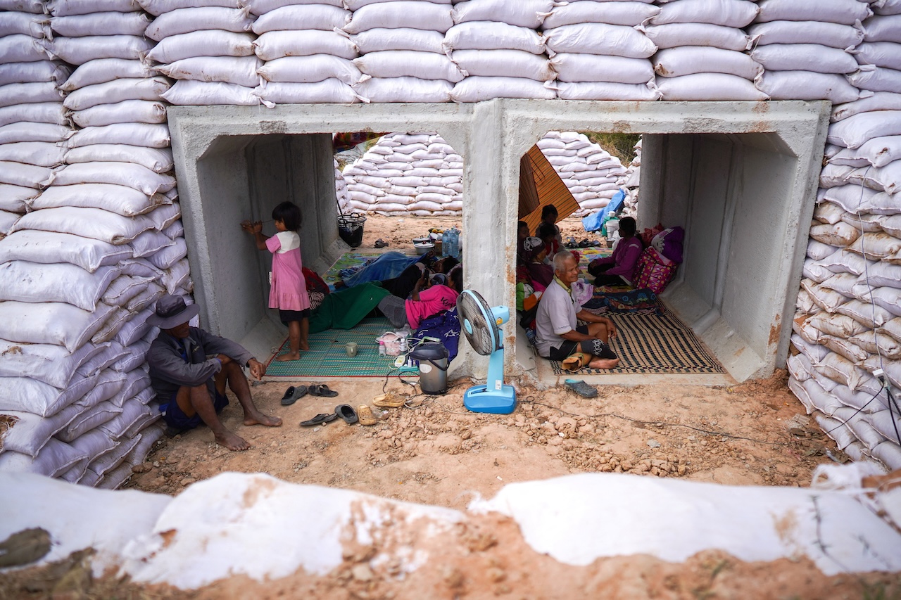 People take shelter inside a bunker amid deadly clashes between Thailand and Cambodia along a disputed border area in Sa Kaeo province, Thailand, on Wednesday. (Reuters)