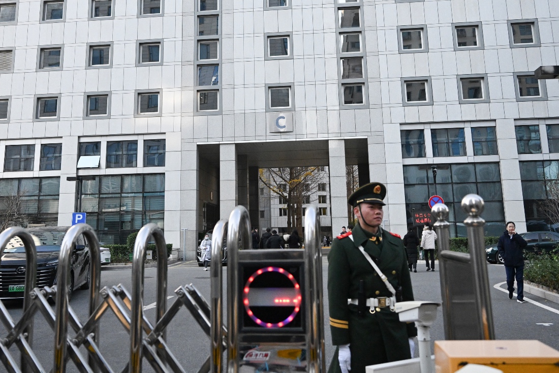 A paramilitary police officer stands guard outside a building of the Foreign Ministry in Beijing, China. (AFP)