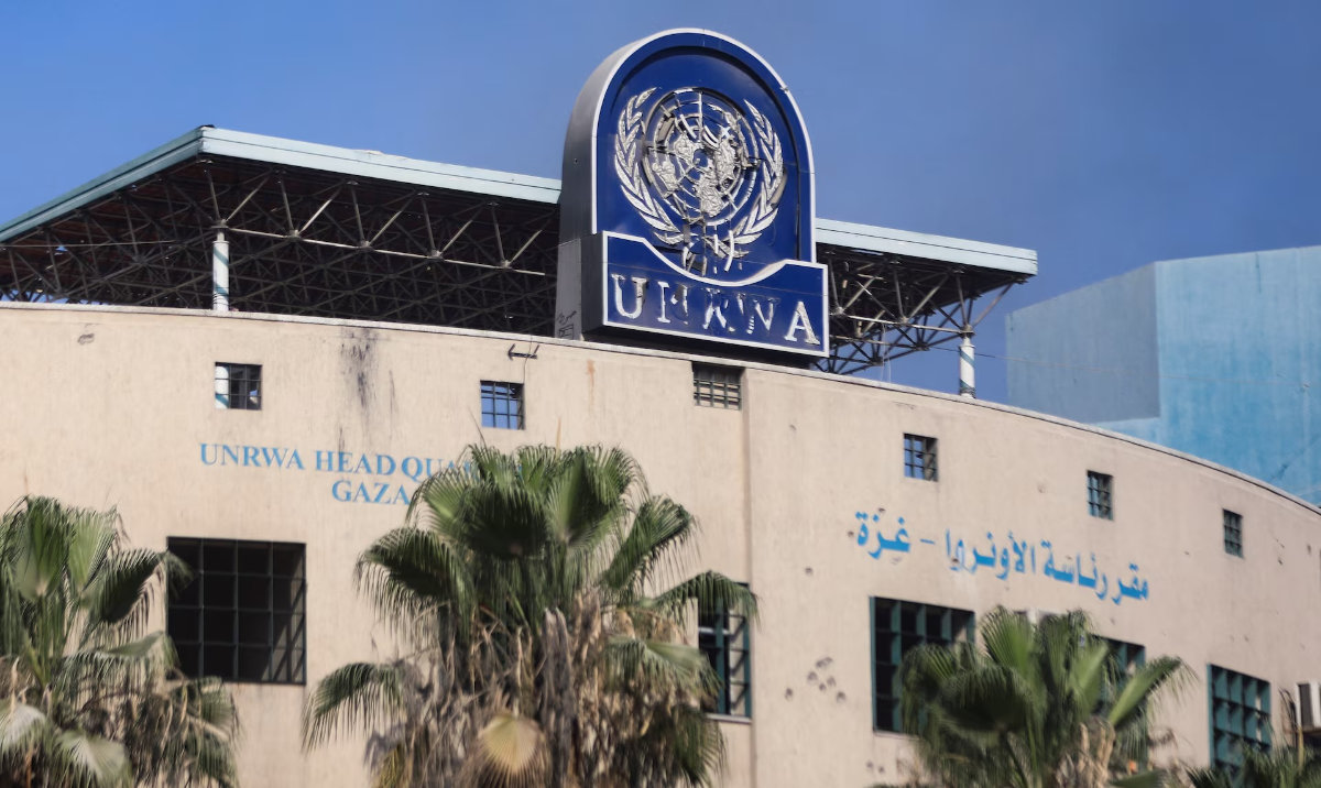 A damaged sign is pictured at the headquarters of UNRWA, following an Israeli raid, amid the Israel-Hamas conflict, in Gaza City. (Reuters/File)