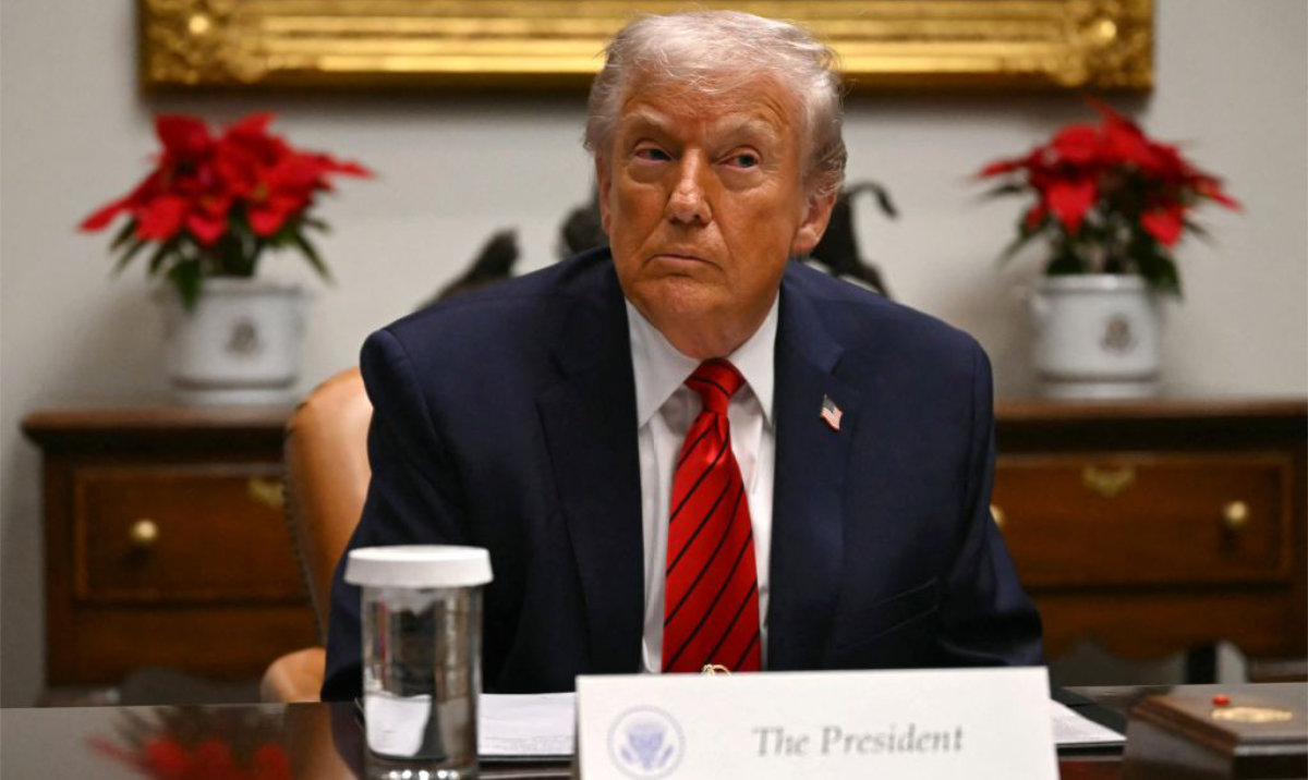 US President Donald Trump looks on during a roundtable discussion in the Roosevelt Room of the White House in Washington, DC, on December 10, 2025. (AFP)