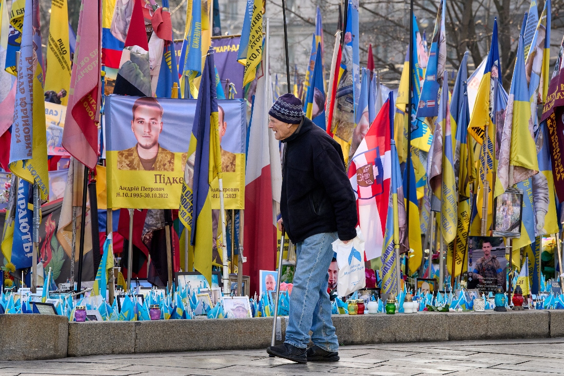 A man walks around an improvised memorial to fallen soldiers killed in the Russia-Ukraine war at Independence square in Kyiv, Ukraine. (AP)