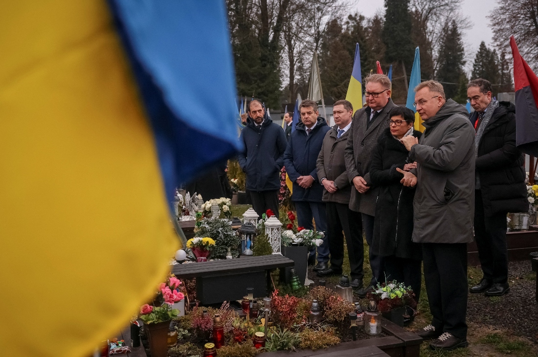 Delegates from European countries attend a commemoration of fallen defenders of Ukraine at a military cemetery in Lviv, Ukraine. (AFP)