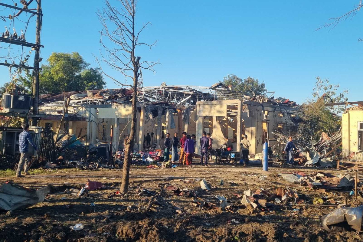 In this photo provided by Wai Hun Aung, people check damaged buildings at the hospital that was allegedly hit by a military air strike in Mrauk-U township in Rakhine state, Myanmar, on Dec.11, 2025. (Wai Hun Aung via AP)