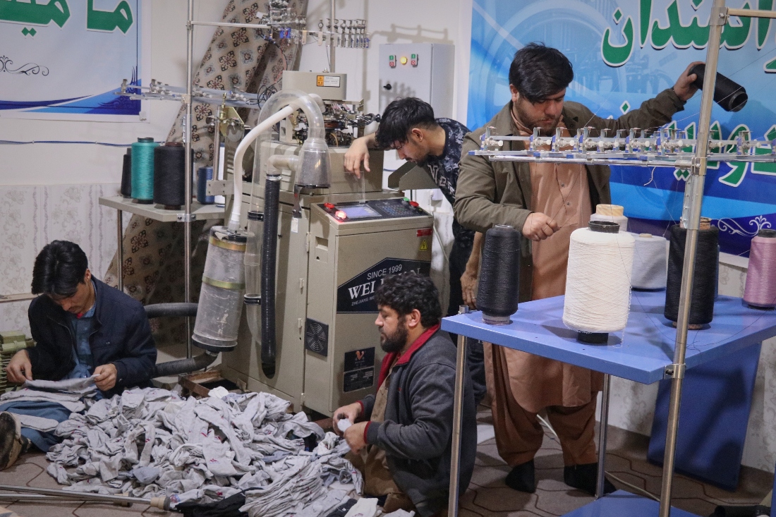 Staff, all with disabilities, sort out spools of thread for making socks in a sock production workshop in the western Afghan city of Herat, Afghanistan. (AFP)