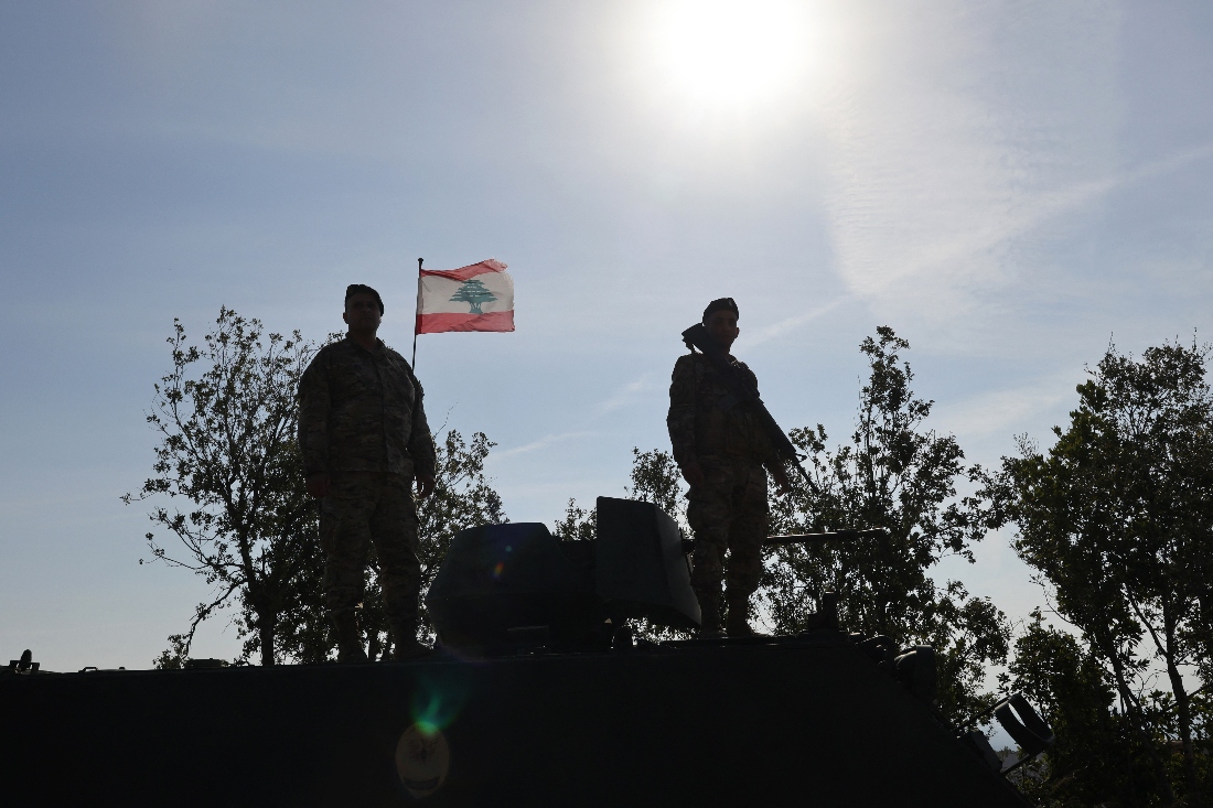 Lebanese soldiers standing atop a military vehicle in Alma Al-Shaab, near the border with Israel in southern Lebanon. (AFP)