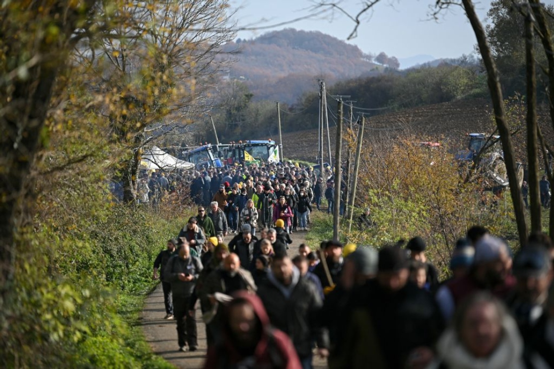 Protestors walk towards a roadblock during a demonstration against the slaughter of a 200-cow herd, following detection of lumpy skin disease (LSD) in Les-Bordes-sur-Arize, France. (AFP)