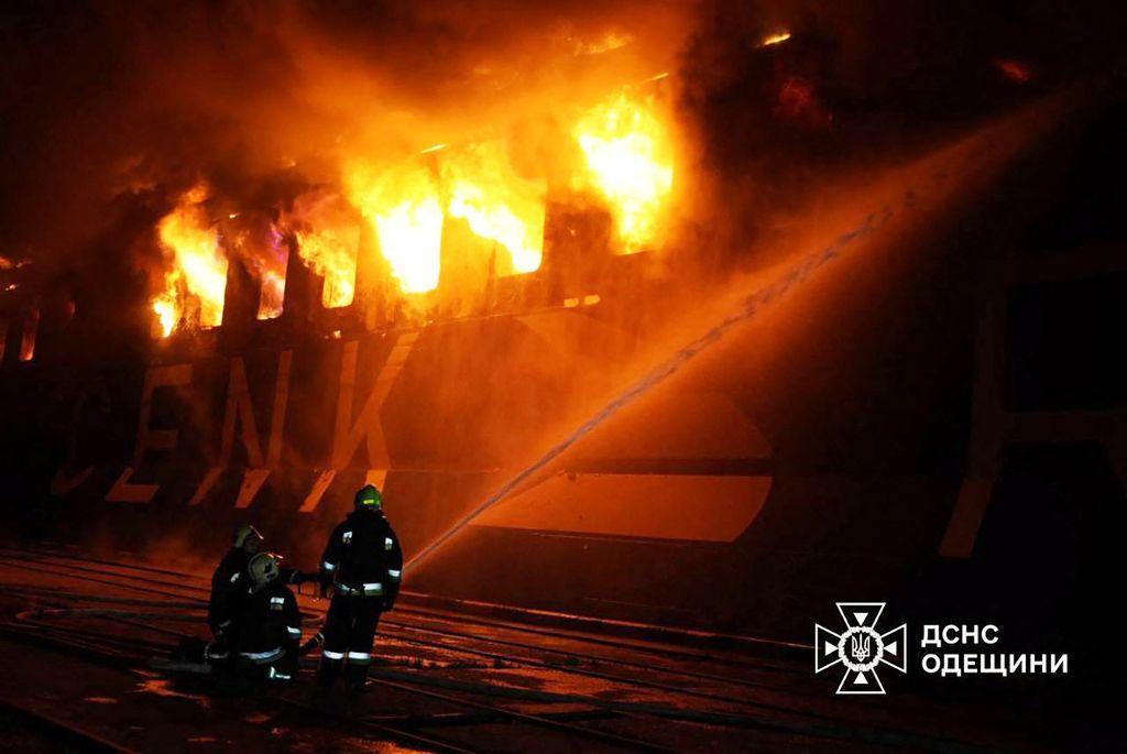 Ukrainian rescuers work to extinguish a fire on a ship following an air attack at the Port of Chornomorsk on Friday. (Via AFP)