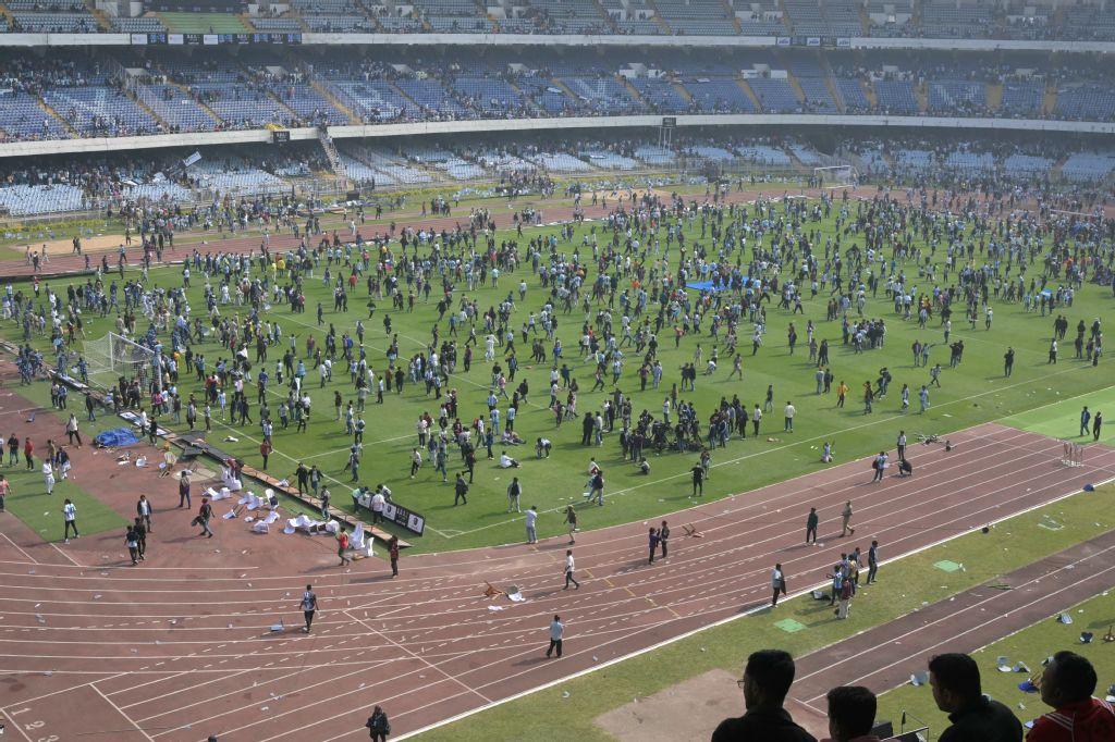 Fans react as Inter Miami's Argentine forward #10 Lionel Messi departs from the Salt Lake Stadium in Kolkata on December 13, 2025. (AFP)