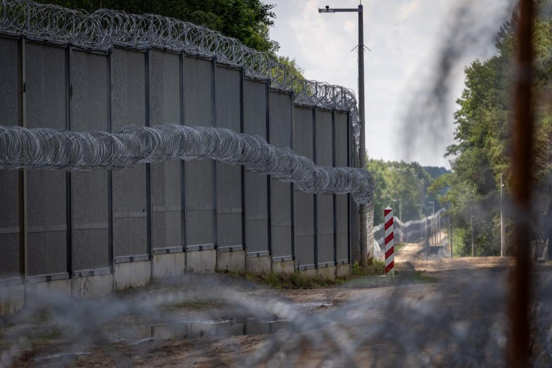 The barbed wired border fence and a Polish border post are seen at the Polish-Belarusian country border in Polowce-Pieszczatka, Poland on July 21, 2025. (AFP)