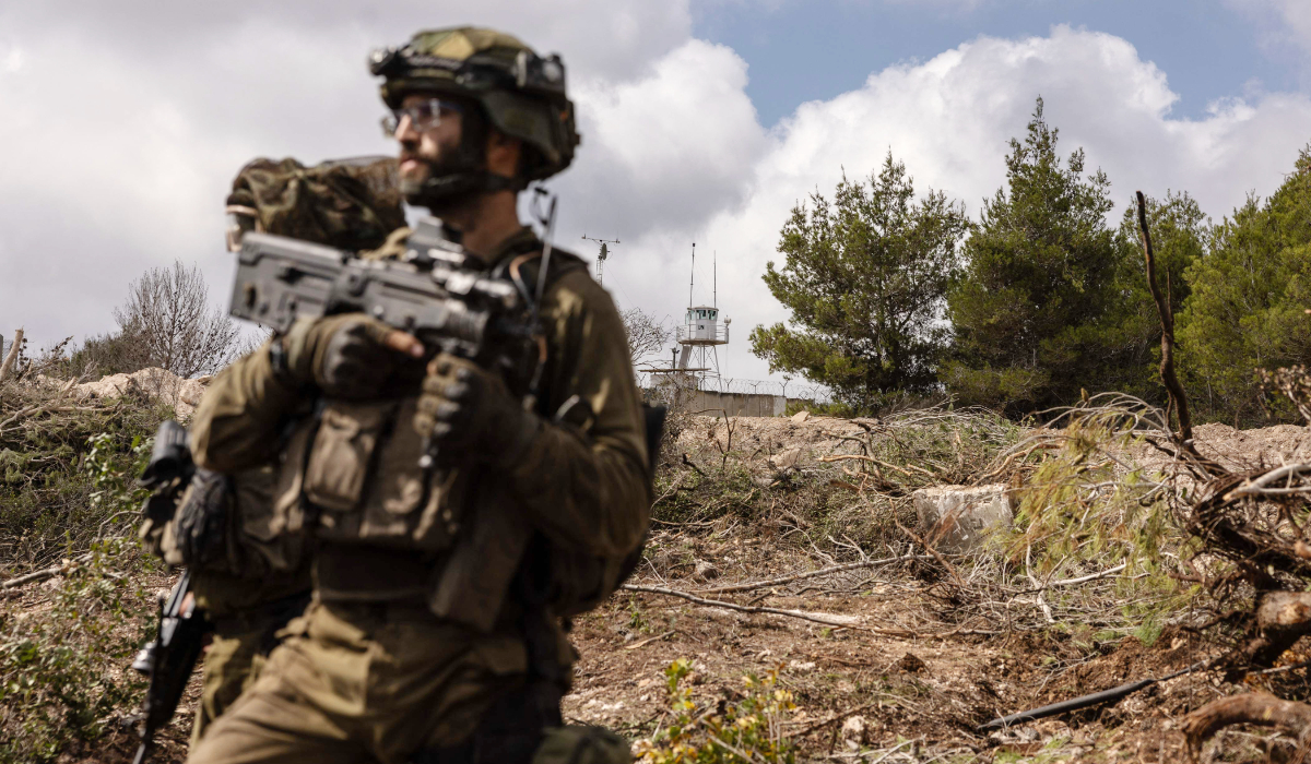 Israeli troops patrolling near a United Nations Interim Force In Lebanon (UNIFIL) base in the southern Lebanon's Naqoura region near the border. (AFP)