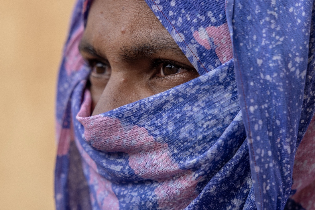 A Malian woman, whose 14-year-old niece was abused by Africa Corps Russian mercenaries in Mali, waits outside the Bassikounou hospital where her niece is being treated in the Hodh El Chargui Region, Mauritania. (AP)