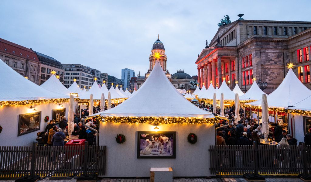 Visitors crowd the Christmas market on the Gendarmenmarkt in Berlin, Germany. (AFP)