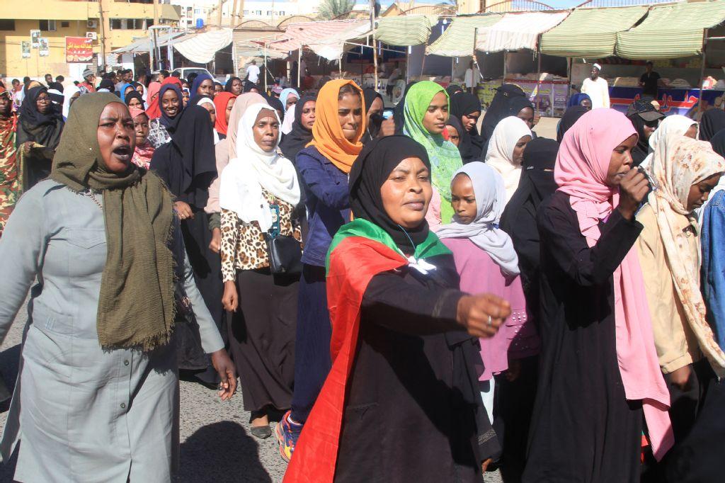 Sudanese take to the street during a rally in support of the Sudanese armed forces in their battle against the paramilitary Rapid Support Forces in Omdurman, part of greater Khartoum on December 13, 2025. (AFP)