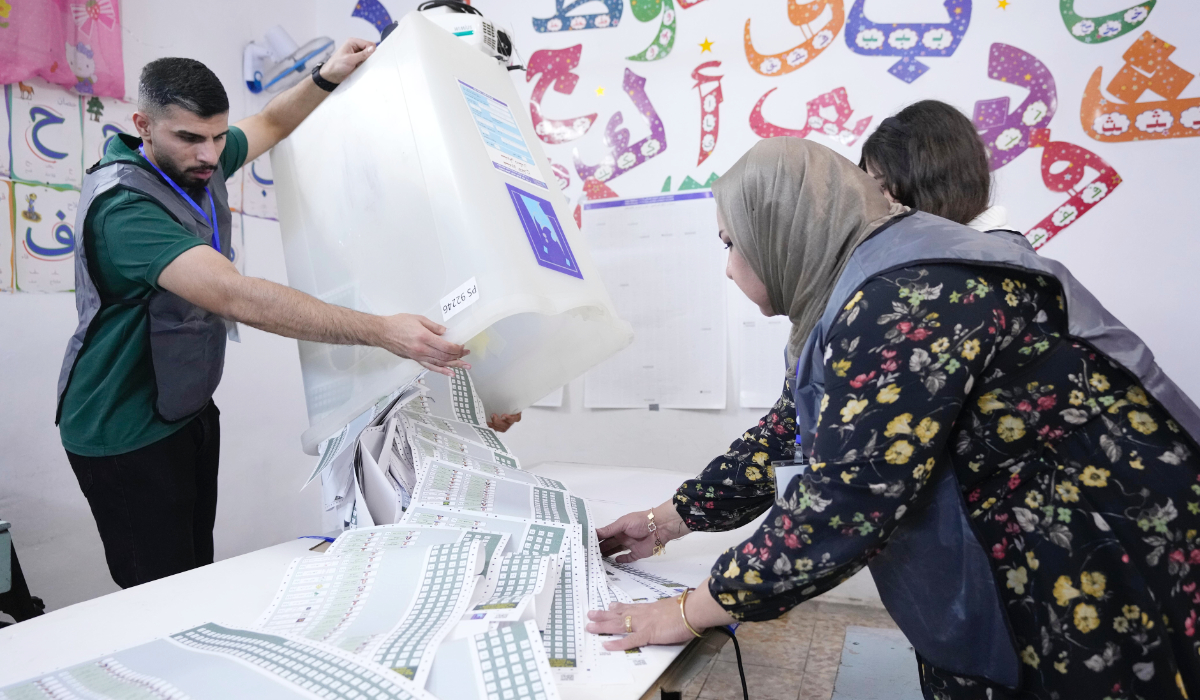 Election workers count ballots as they close a polling station, during the parliamentary elections in Baghdad, Iraq, Nov. 11, 2025. (AP)