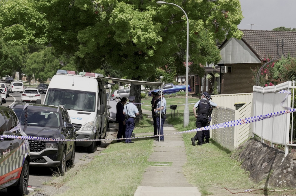 Police officers stand guard outside the house of the suspects of a shooting incident on a Jewish holiday celebration at Bondi Beach, in Bonnyrigg, Sydney, Australia, December 15, 2025. (REUTERS)
