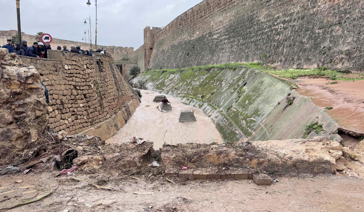 Flood water run in the moat of a fortress following a flash flood, in the coastal town of Safi, some 300 kilometres (186 miles) south of the capital Rabat on December 15, 2025. (AFP)